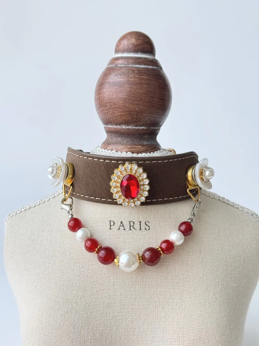 Heirloom Rose — rhinestone and pearl petals around a vintage ruby centrepiece